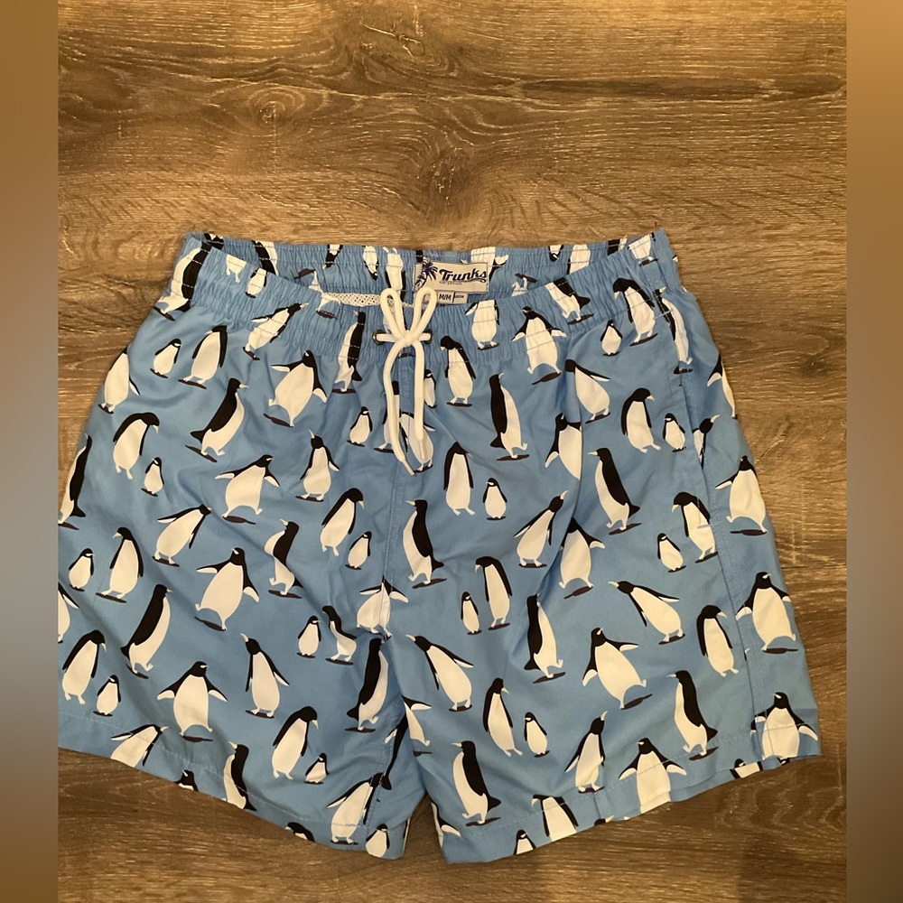 Trunks brand men’s blue swim trunks with penguins
